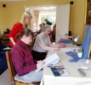 small-Art-and-Craft-Tutor-Raya-Brown-with-her-adult-students-teaching-how-to-draw-still-life-to-complete-beginners-at-her-studio-in-Worcestershire